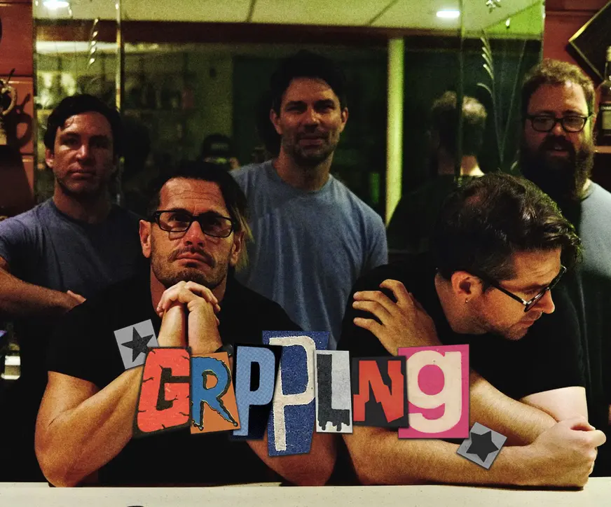 Members of the band GRPPLNG, chillin' at the bar.