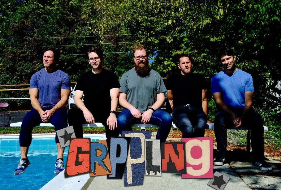 Members of the band GRPPLNG, chillin' at the pool.