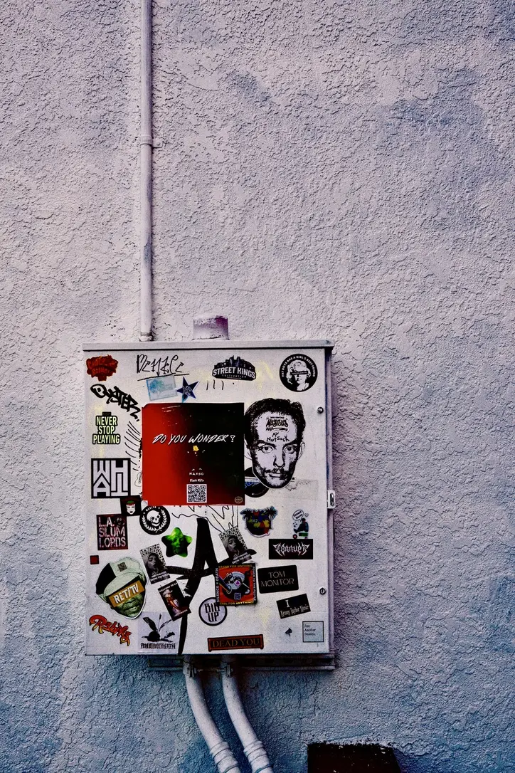 An electrical box covered in stickers behind the Guitar Center on Sunset Blvd.