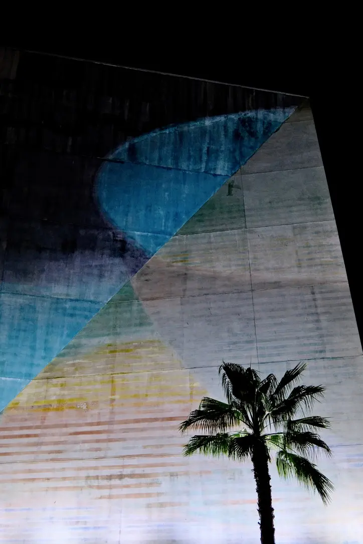 A skyscraper in Los Angeles at night.